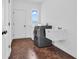 Clean laundry room features a large sink, modern washer and dryer units, and neutral paint at 10792 Harbor Bay Dr, Fishers, IN 46040