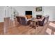 Inviting living room with a fireplace, a television, comfortable seating, and hardwood floors at 10792 Harbor Bay Dr, Fishers, IN 46040