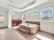 Main bathroom featuring a soaking tub with tiled surround and bright windows at 10792 Harbor Bay Dr, Fishers, IN 46040