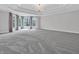 Large main bedroom features tray ceiling, chandelier, and bay windows with attractive curtains at 10792 Harbor Bay Dr, Fishers, IN 46040