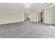 Expansive main bedroom with tray ceiling, chandelier, and double doors at 10792 Harbor Bay Dr, Fishers, IN 46040