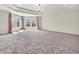 Spacious main bedroom with large windows, tray ceiling, and elegant chandelier at 10792 Harbor Bay Dr, Fishers, IN 46040