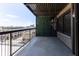 Relaxing balcony features green wall and iron railing with a cityscape view at 110 E Washington St # 802, Indianapolis, IN 46204