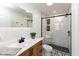 Beautiful bathroom featuring a modern vanity, sleek fixtures, and a tiled walk-in shower at 110 E Washington St # 802, Indianapolis, IN 46204