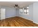 Cozy bedroom featuring hardwood floors, a ceiling fan, and lots of natural light at 110 E Washington St # 802, Indianapolis, IN 46204