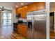 Modern kitchen features stainless steel appliances and light wood cabinets in open layout at 110 E Washington St # 802, Indianapolis, IN 46204