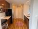 Kitchen features hardwood floors, granite counters, stainless appliances, and ample cabinet space at 110 E Washington St # 802, Indianapolis, IN 46204