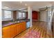 Modern kitchen with updated cabinets, stainless steel appliances, and exposed brick accents at 110 E Washington St # 802, Indianapolis, IN 46204