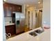 Updated kitchen featuring granite counters, stainless steel appliances, and hardwood floors at 110 E Washington St # 802, Indianapolis, IN 46204