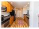 Updated kitchen with stainless steel appliances, modern cabinetry, and hardwood flooring at 110 E Washington St # 802, Indianapolis, IN 46204