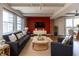 Cozy living room featuring comfortable seating, a media center, and a dining area with large windows at 110 E Washington St # 802, Indianapolis, IN 46204