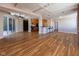 Spacious living area features hardwood floors, high ceilings, and an open layout leading to the kitchen at 110 E Washington St # 802, Indianapolis, IN 46204