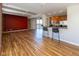 Bright and airy living space featuring hardwood floors, a breakfast bar, and an exposed brick wall at 110 E Washington St # 802, Indianapolis, IN 46204