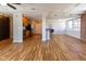 Spacious living room featuring an open layout with hardwood floors and a modern kitchen area at 110 E Washington St # 802, Indianapolis, IN 46204
