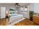 Serene main bedroom with a large window, ceiling fan, and neutral decor at 110 E Washington St # 802, Indianapolis, IN 46204