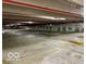 Spacious parking garage with concrete floors and clearly marked parking spaces, ensuring easy access and convenience at 110 E Washington St # 802, Indianapolis, IN 46204