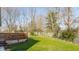 A spacious backyard with grass lawn and a raised wooden deck at 11930 Titania Cir, Indianapolis, IN 46236