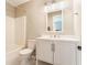 Modern bathroom with white vanity, tiled floors, and a shower-tub combination at 11930 Titania Cir, Indianapolis, IN 46236