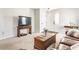 Cozy living room with plush seating, a wooden coffee table, and a view of the front entryway at 11930 Titania Cir, Indianapolis, IN 46236