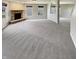 An expansive, unfinished basement with neutral carpet, ready for your personal touches and customization at 12416 Teacup Way, Indianapolis, IN 46235