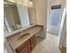 Bathroom featuring a large vanity and separate toilet at 12416 Teacup Way, Indianapolis, IN 46235