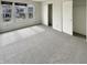 Bedroom featuring bright windows, fresh paint, and neutral carpeting at 12416 Teacup Way, Indianapolis, IN 46235