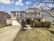 Charming two-story home boasts well-maintained landscaping, attached garage, and inviting curb appeal at 12416 Teacup Way, Indianapolis, IN 46235