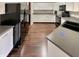 Functional kitchen with white cabinets, dark appliances, and durable countertops at 12416 Teacup Way, Indianapolis, IN 46235