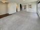 Open-concept living room with abundant natural light and neutral decor at 12416 Teacup Way, Indianapolis, IN 46235