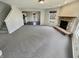 Cozy living area with a stone fireplace and an open layout at 12416 Teacup Way, Indianapolis, IN 46235
