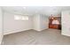 Finished basement featuring a wet bar area with cherry cabinets, mini-fridge, and carpeted floors at 13082 Overview Dr # 5A, Fishers, IN 46037
