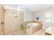 Bathroom with a walk-in shower and separate tub at 13082 Overview Dr # 5A, Fishers, IN 46037