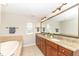 A bathroom with a large vanity and a separate tub at 13082 Overview Dr # 5A, Fishers, IN 46037