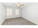 Neutral bedroom with two windows, ceiling fan, and carpeted floors at 13082 Overview Dr # 5A, Fishers, IN 46037