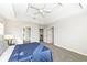Bedroom with large windows, neutral walls, and a ceiling fan at 13082 Overview Dr # 5A, Fishers, IN 46037
