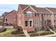 Charming brick townhome with manicured lawn and inviting front entrance at 13082 Overview Dr # 5A, Fishers, IN 46037