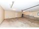 Spacious two car garage with concrete floors, an overhead door, and ample room for parking and storage at 13082 Overview Dr # 5A, Fishers, IN 46037
