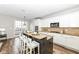 Modern kitchen featuring granite countertops, stainless steel appliances, and large island with barstool seating at 13082 Overview Dr # 5A, Fishers, IN 46037