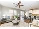 Open living space with combined living room and kitchen with access to outdoor deck at 13082 Overview Dr # 5A, Fishers, IN 46037