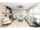 Inviting living room with brick fireplace, ceiling fan, and plush seating at 13082 Overview Dr # 5A, Fishers, IN 46037