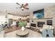 Inviting living room with stone fireplace, open to kitchen, and modern decor at 13082 Overview Dr # 5A, Fishers, IN 46037
