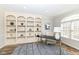 Home office featuring built-in bookshelves, large window, and ample lighting at 13082 Overview Dr # 5A, Fishers, IN 46037