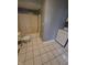 Tiled bathroom featuring a shower-tub combo, toilet, and dryer at 1410 St Paul St, Indianapolis, IN 46203