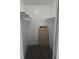 Small closet with shelving, carpet, and white walls at 1410 St Paul St, Indianapolis, IN 46203