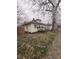Inviting single-story home with a well-manicured lawn and mature trees at 1410 St Paul St, Indianapolis, IN 46203