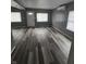 Bright living room with new flooring, freshly painted walls, and plenty of natural light at 1410 St Paul St, Indianapolis, IN 46203
