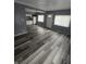 Open-concept living space with wood floors, seamlessly connected to the kitchen at 1410 St Paul St, Indianapolis, IN 46203