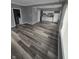 Spacious layout with a view into the kitchen and laundry room, highlighted by modern flooring at 1410 St Paul St, Indianapolis, IN 46203