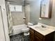 Cozy bathroom with tile shower, vanity, and patterned flooring at 151 N 8Th Ave, Beech Grove, IN 46107