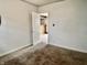 Bedroom with neutral walls, carpet, and an open doorway to another room at 151 N 8Th Ave, Beech Grove, IN 46107